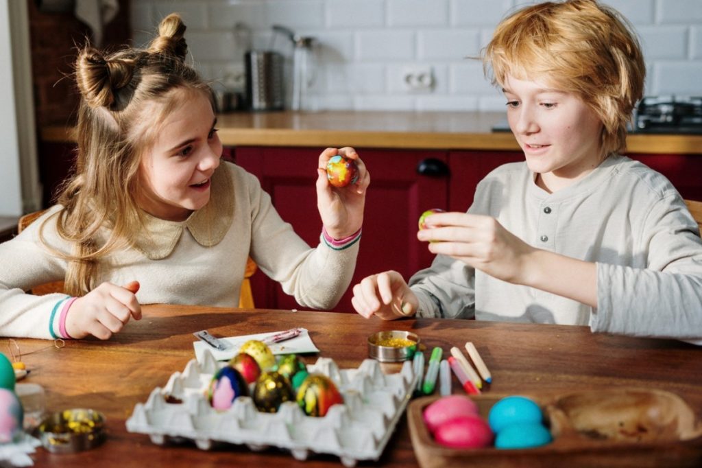 children painting eggs