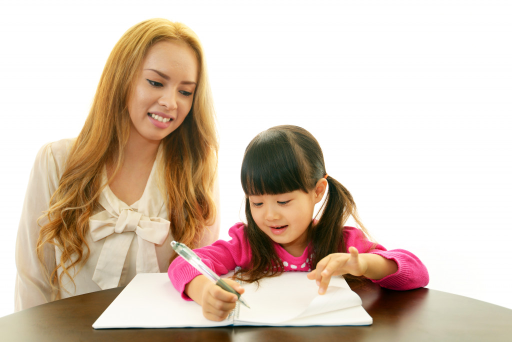 a tutor teaching a kid
