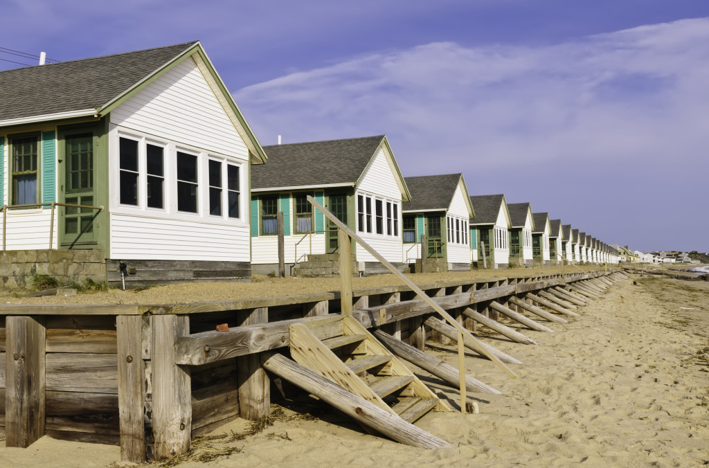 long row of identical white beach cottages
