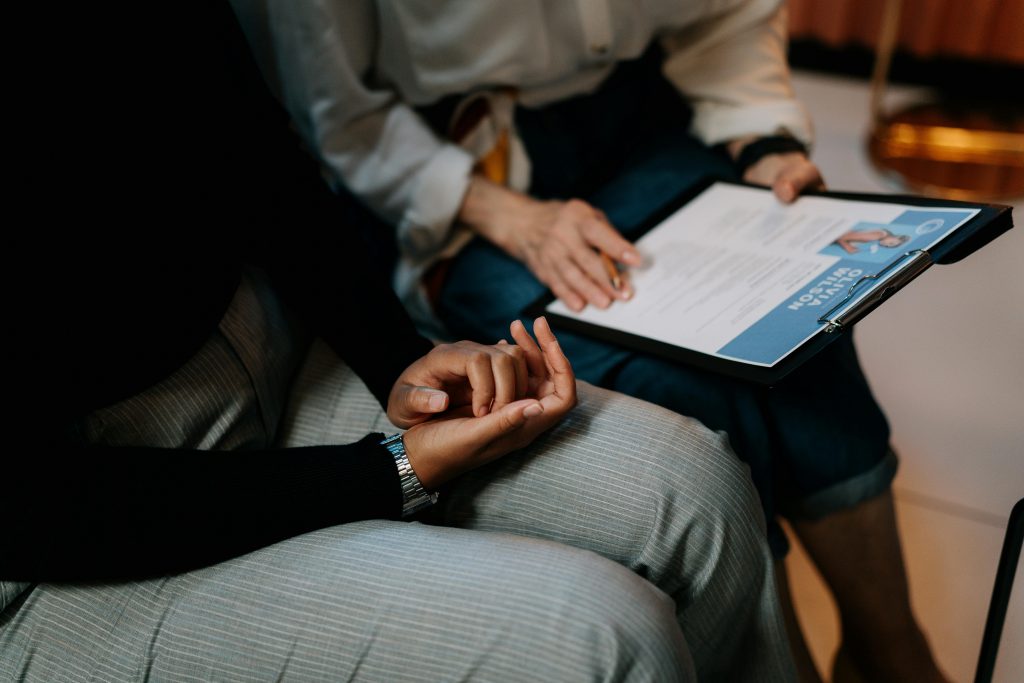 two hiring managers reading a candidate's resume