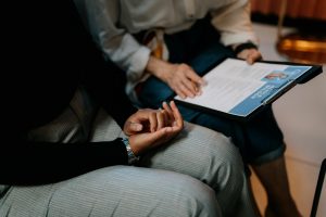 two hiring managers reading a candidate's resume